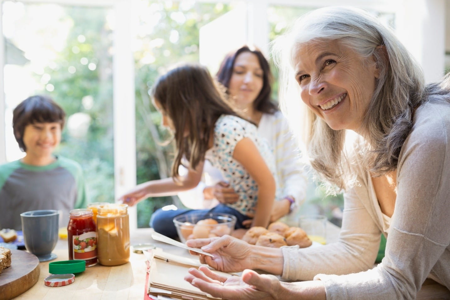 smiling grandma with daughter and grand kids.