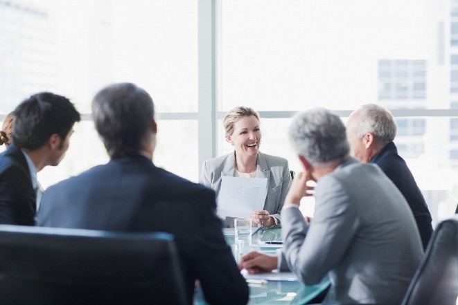 group of business people at conference table.